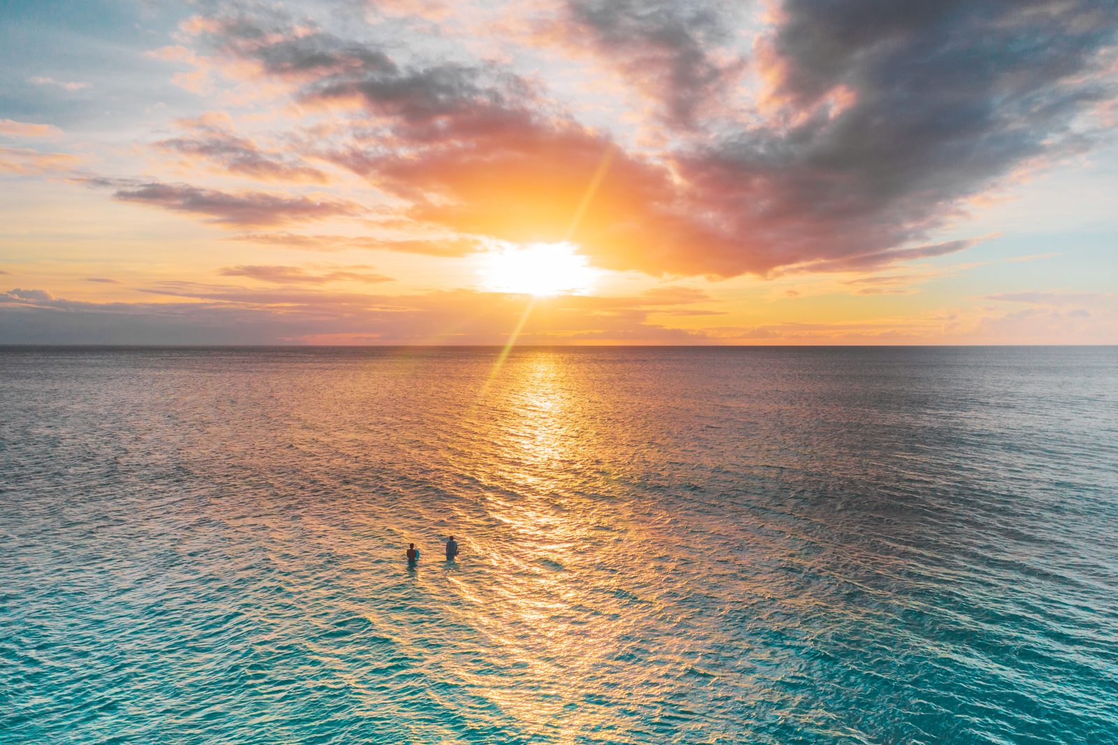 Sun setting over open water