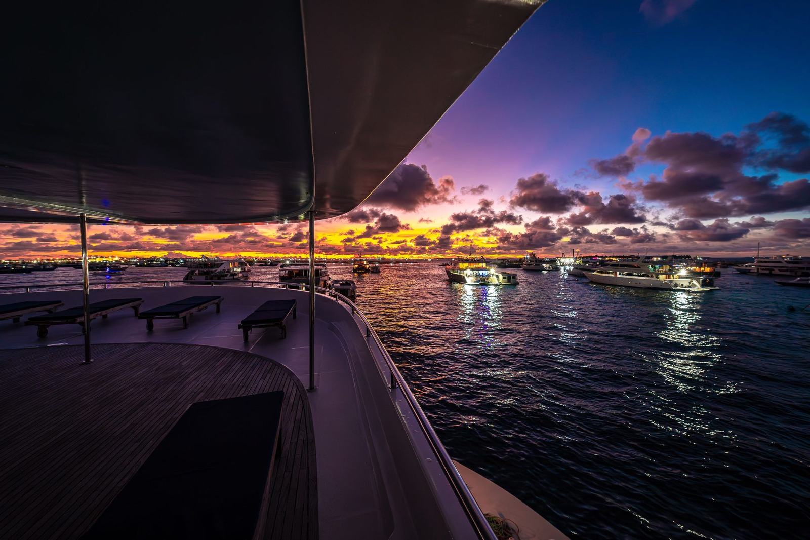 Harbor at dusk seen from the deck of a boat
